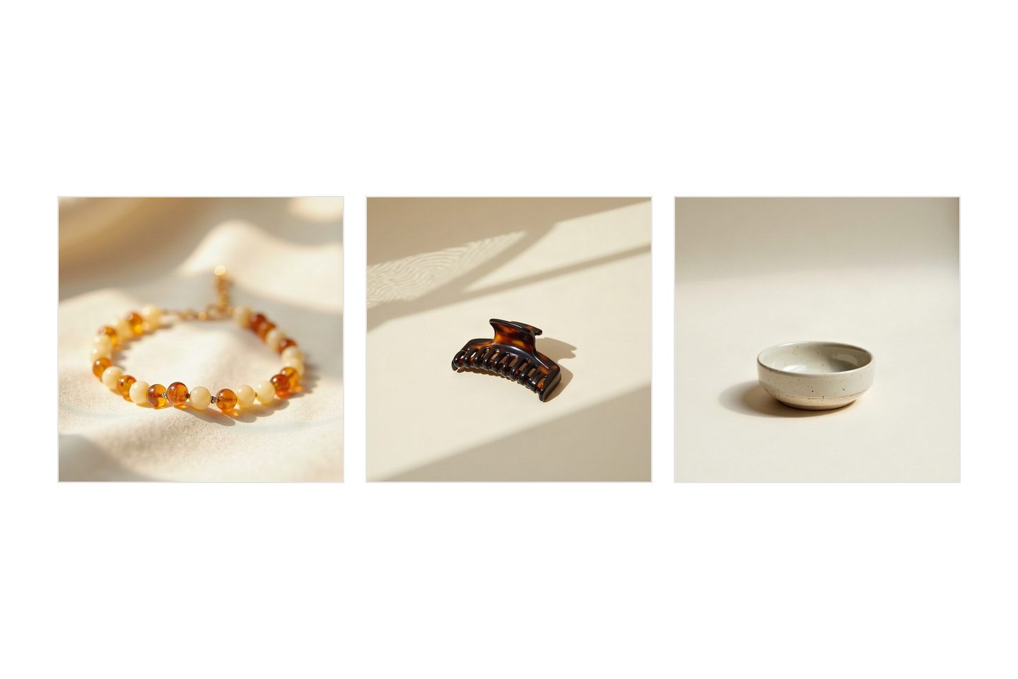 Three unrelated products photographed on one unchanged set: an amber bead bracelet on a fold of cream linen, a tortoiseshell claw clip on a cream ground, and a speckled stoneware dish. The ground, the direction of the light and the shape of the shadow are the same in all three.
